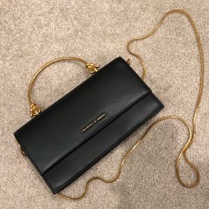 Charles & Keith black clutch bag with gold